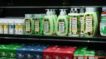 CBD cosmetics, various skin and body creams, serums, balms and shampoos on the shelf